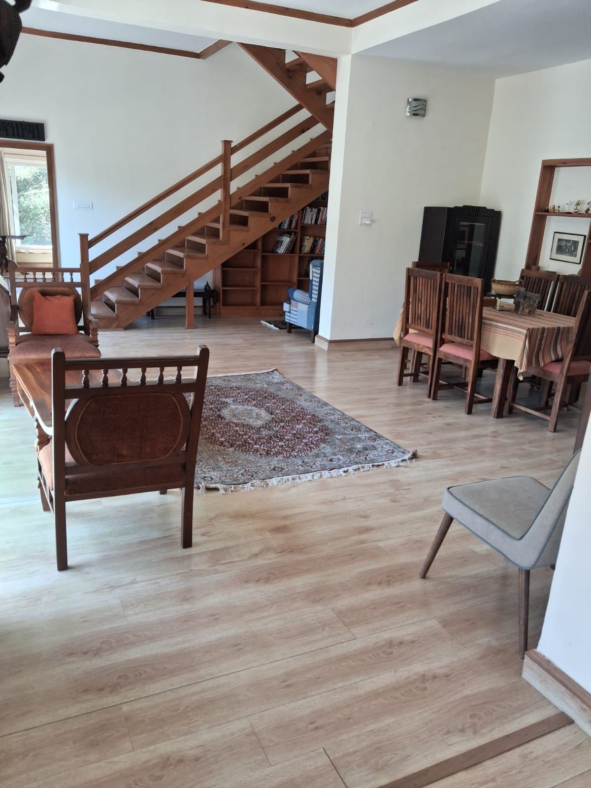 Dining area with the library under the staircase