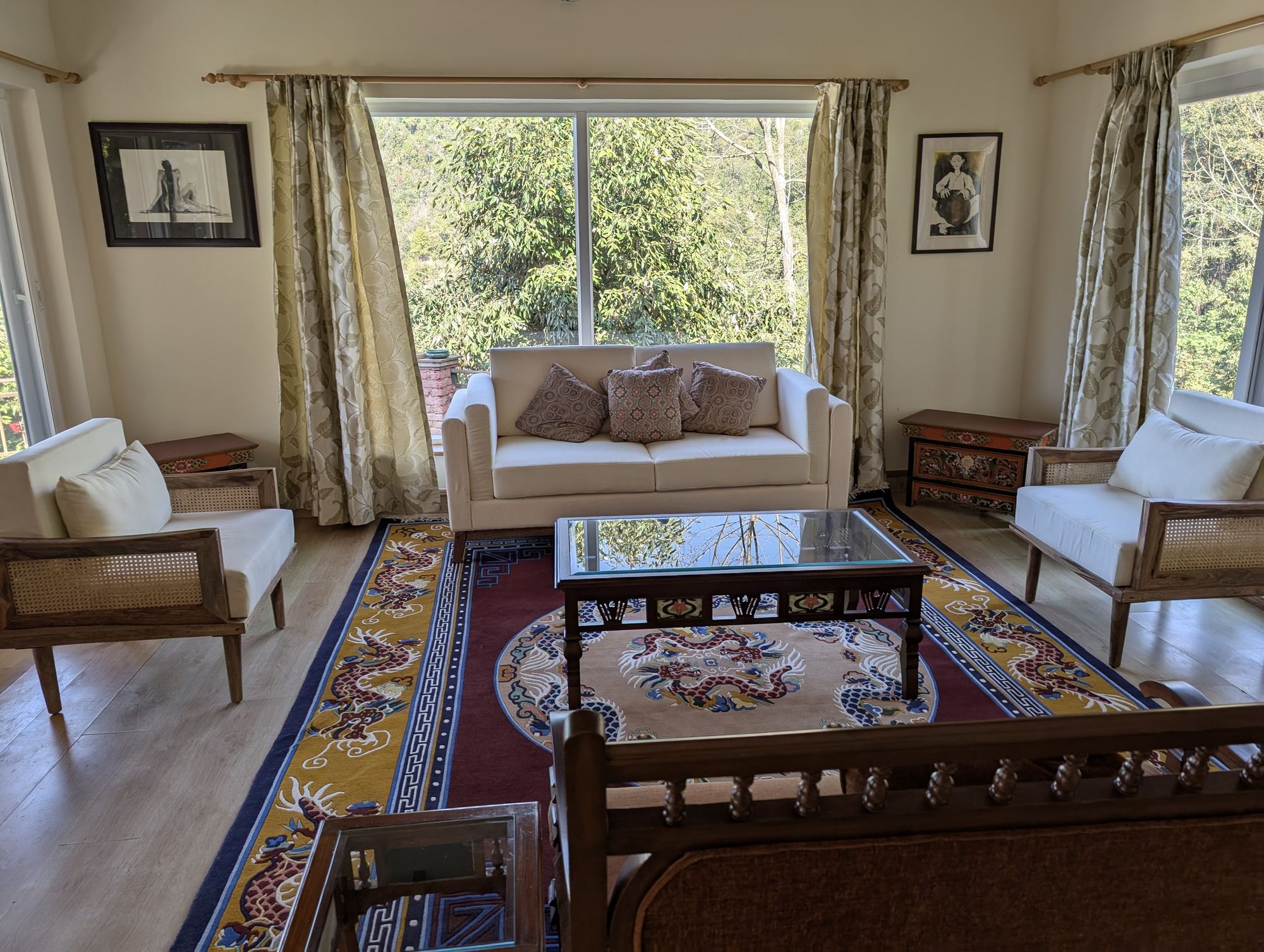 Living room with white sofas and a Tibetan dragon rug